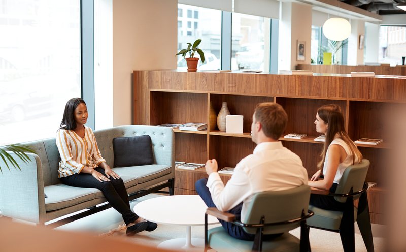 Skyline Acquisitions team members meeting in a Charlotte Metro office